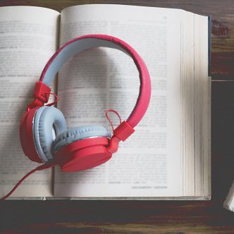 concept-audiobook-books-table-with-headphones-put-them